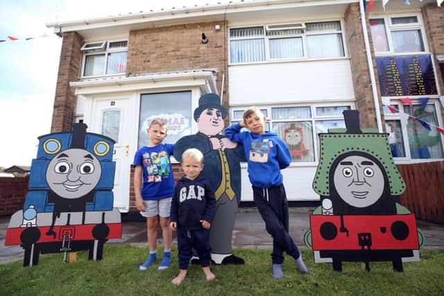 Judging of the best dressed garden, house and business takes place on Hartlepool Headland. At a house on Lumley Square are Milo Strelitz (7), Olly Bradley (2) and Logan Dennis (7) with a Thomas the Tankengine-themed house. Picture: CHRIS BOOTH