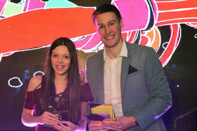 Courtney Hadwin receiving the Child of Achievement prize at the Best of Hartlepool Awards, presented by former Hartlepool United footballer Tony Sweeney.