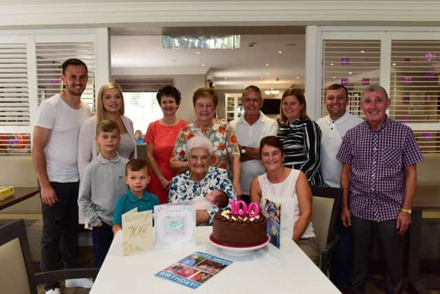 Geraldine Kirkbride celebrating her 100th birthday with her family and friends.