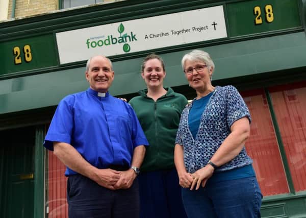 Taking to the skies for a parachute jump in aid of Hartlepool Foodbank are Rev Clive Hall (left) and Susan Atkinson (right) pictured with Abi Knowles of the Foodbank.