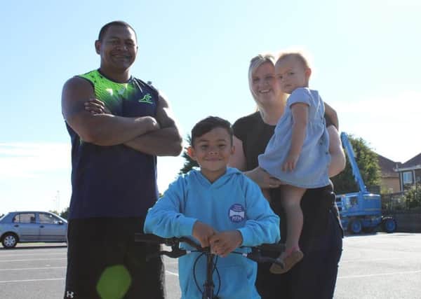 Lewin with dad Suli, mam Lynsey and little sister Mia.