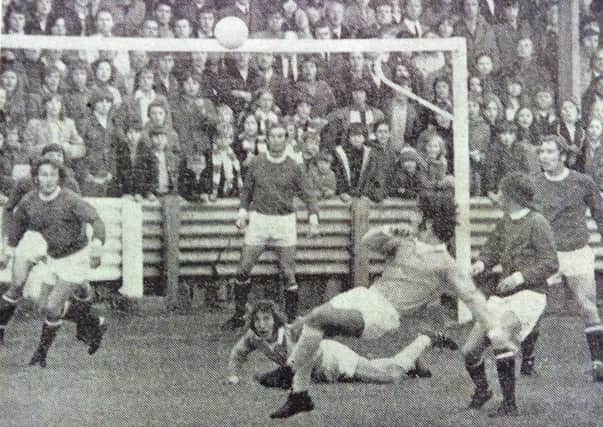 Goalmouth action from the Pools-Workington match.