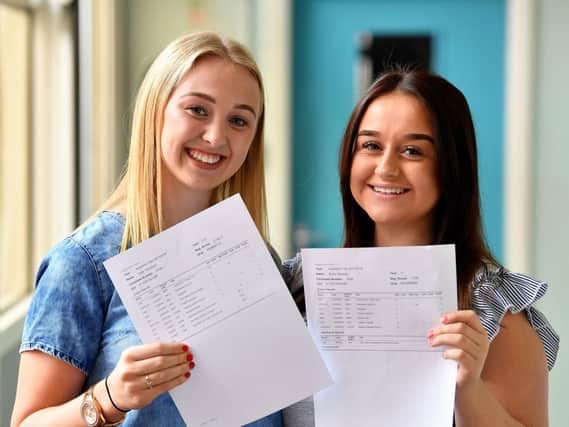 Kate Nicholson (left) and Emily Buckley with their GCSE results at English Martyrs School