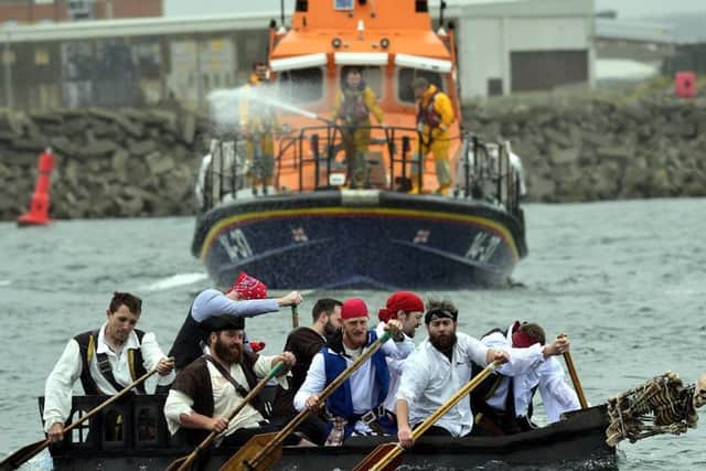 The pirates team heading for the shoreline.