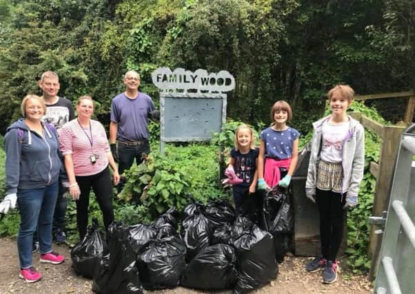 Participants of the Big Clean initiative with rubbish they collected from the Burn Valley Family Wood.