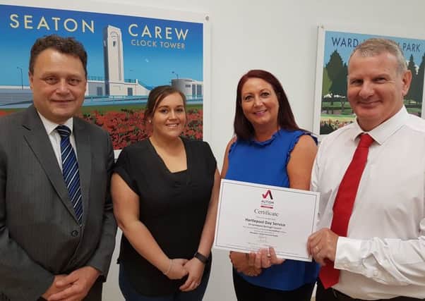 Councillor Stephen Thomas, autism champion Laura Reeve, team co-ordinator Caroline Armstrong and provider services manager Chris Horn with the National Autistic Society certificate of accreditation.