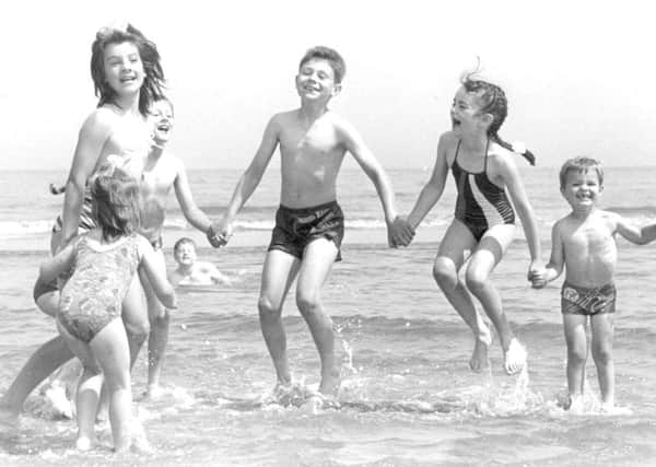 Children have a splashing good time playing on Seaton Carew beach.