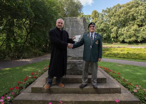 Stephen Close (left) with Brian Coward of the DLI Association receiving a cheque for Â£250 towards a new Boer War statue in Ward Jackson Park, Hartlepool.