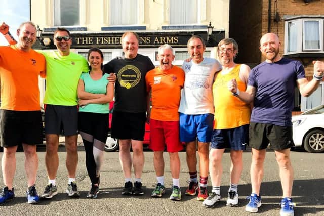 Phil Holbrook and members of Team Sally fundraising group on one of their annual 5k runs on the Headland in June.