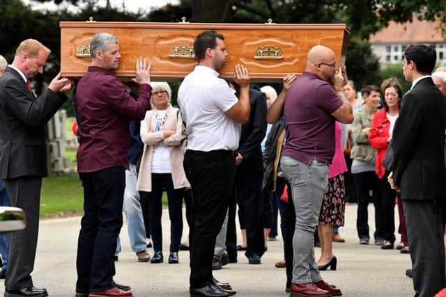 Mark Twydale's coffin is about to be carried into Stranton Crematorium. Picture by FRANK REID