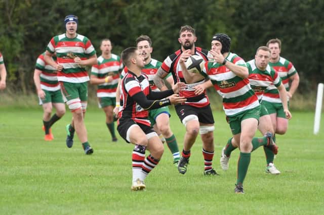 West Hartlepool (red/green/white) v Hartlepool Rovers (red/white/black) at Brinkburn, Hartlepool, on Saturday.