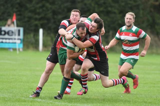 West Hartlepool (red/green/white) v Hartlepool Rovers (red/white/black) at Brinkburn, Hartlepool, on Saturday.