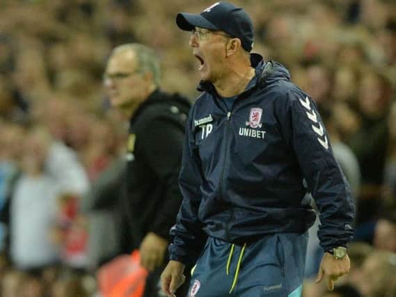 Middlesbrough manager Tony Pulis pictured with Leeds' Marcelo Bielsa in the background