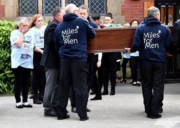 Jackie Fletcher blows a kiss as her husband Tommy Fletcher's coffin is carried out of the Chapel at Stranton Crematorium. Picture by FRANK REID