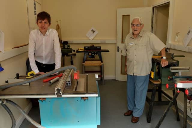 The Men's Shed's youngest and oldest users, 17-year-old Michael Bullivant and Stan Butterfield aged 90 in the new extension.