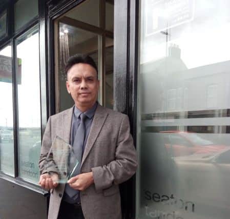 Seaton Tandoori owner Syed Dulal with the award.