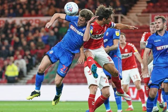 George Friend (right) and Bolton Wanderers' Joe Williams clash.
