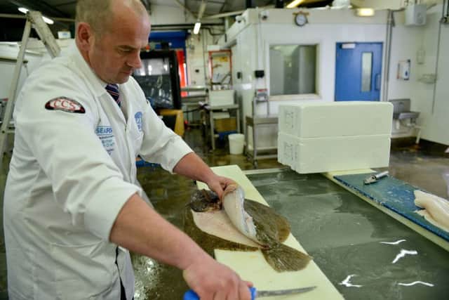 Fishmonger of the year Alan Barker from Hodgson Fish at work. Picture by FRANK REID