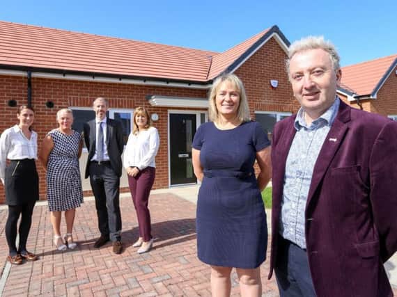 Councillor Christopher Akers-Belcher, Leader of Hartlepool Borough Council, with Sharon Thomas, Thirteens Director of New Homes Delivery, and (left-right) Amy Waller, Hartlepool Borough Councils Principal Housing Officer; Marian McDonald from Thirteen; Tim Wynn, Hartlepool Borough Councils Strategic Asset Manager; and Denise Ogden, Hartlepool Borough Councils Director of Regeneration and Neighbourhoods.