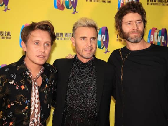 Mark Owen, Gary Barlow, and Howard Donald of Take That, who have announced a Greatest Hits tour to celebrate their 30th anniversary in 2019.