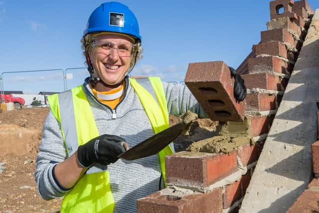 Revd Claire lays final brick for the new Wynyard CofE Primary School. Picture: Keith Blundy