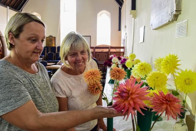 Julie Potter (left) and Margaret Collin admiring the flowers at the show.