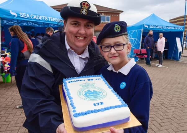 Hartlepool Sea Cadets held an Open Day on Saturday as part of their 80th anniversary. Petty Officer Jane Fox cammonding officer Hartlepool Sea Cadets with Junior Cadet Hollie Wilson with the Cadets 80th birthday cake