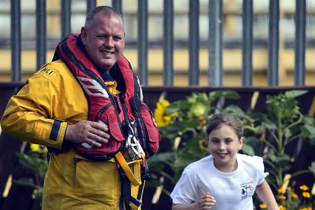 Millie Crangle with dad Mark. Picture by RNLI/Tom Collins