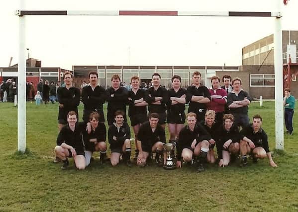 The cup-winning first XV from 1987 with the Durham Challenge Trophy.