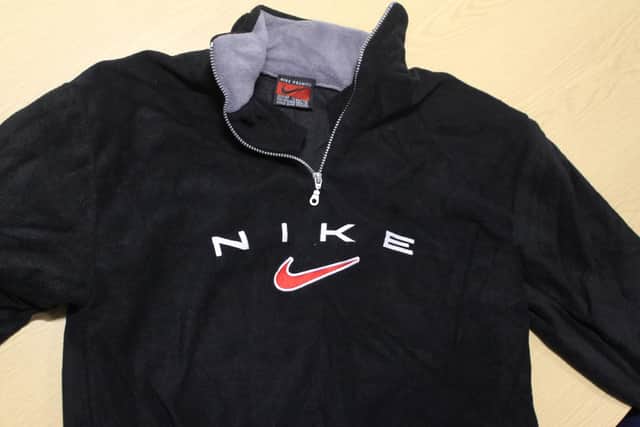 A jumper bearing the Nike logo.