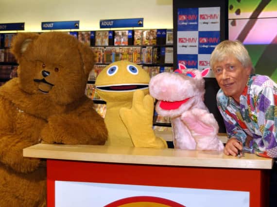Rainbow presenter Geoffrey Hayes with co-stars Bungle, Zippy and George. Pic: Myung Jung Kim/PA Wire