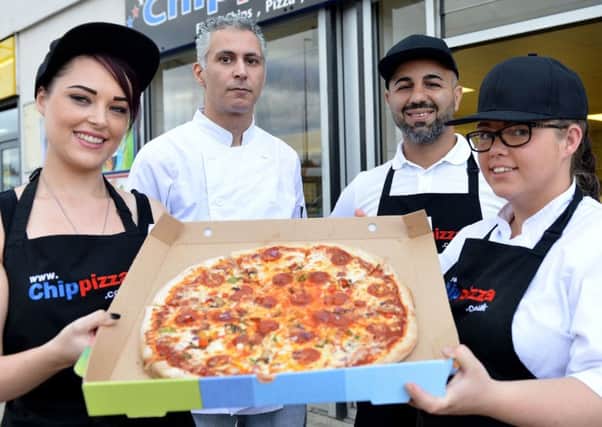 Shah Shabazi owner of  Chippizza (rear right) with staff members Camron Sals and Amy Hume (front left) and Jess Lloyd. Picture by Frank Reid