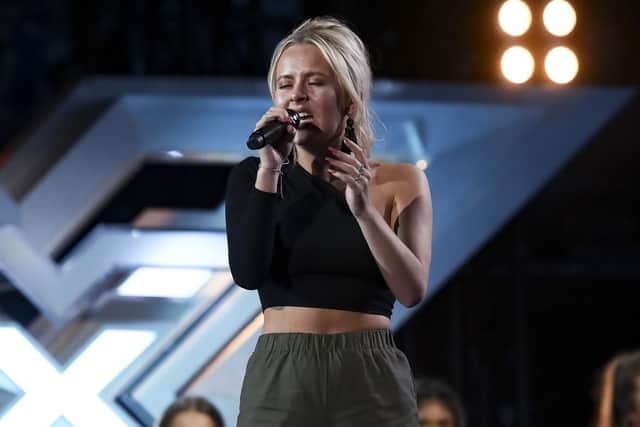 Molly Scott in the Six Chair Challenge in X Factor.