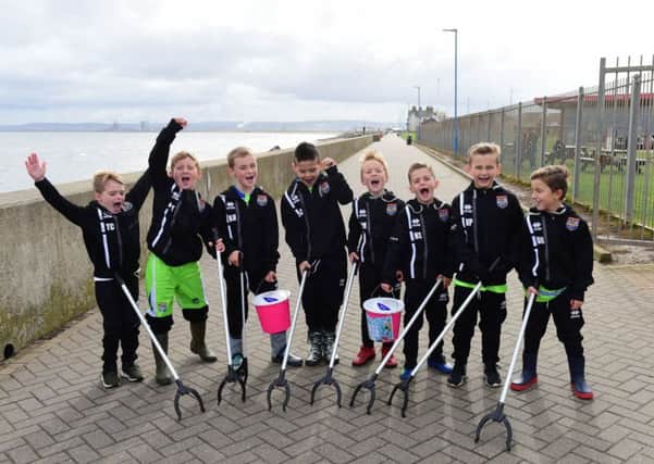Seaton Carew under 8s football team took part in a sponsored beach clean to raise money on Seaton beach on Saturday.