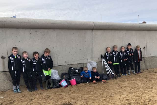 Seaton Carew Under 8s Football side after completing their sponsored beach clean.