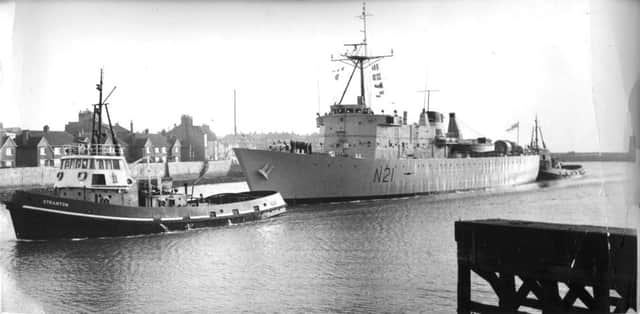 HMS Abdiel pictured sailing into Hartlepool assisted by two Hartlepool tugs.