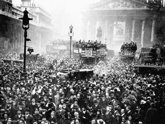 A huge crowd gathered outside the Stock Exchange and the Bank of England in London after the announcement of the Armistice, which heralded the end of the First World War. Picture: PA Archive/Press Association Images