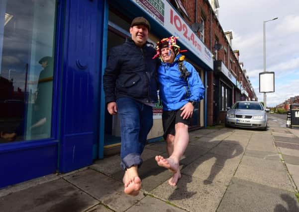 Brest foot forward, Paul Suggitt walking barefoot around the town in training for a barefoot challenge he is doing next year, pictured with Councillor Stephen Akers-Belcher, on Saturday.