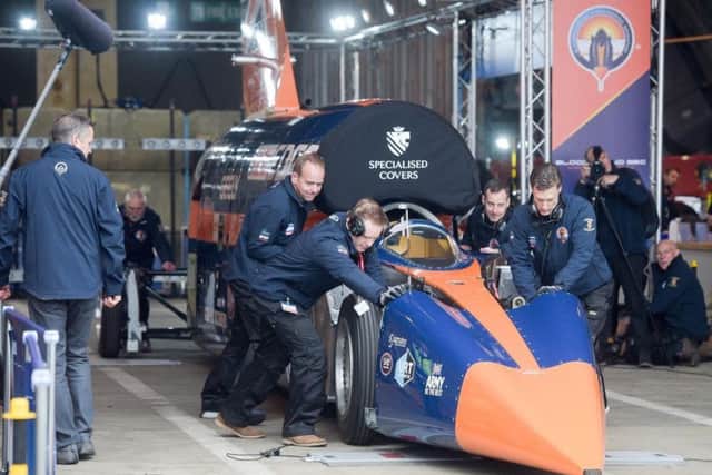 BLOODHOUND SSC is pushed out of the hangar by technicians at Newquay airport, Cornwall, where the supersonic car prepares to make its first run up to 200mph. Picture: Ben Birchall/PA Wire