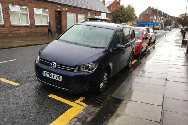 The new double yellow lines in Raby Road.