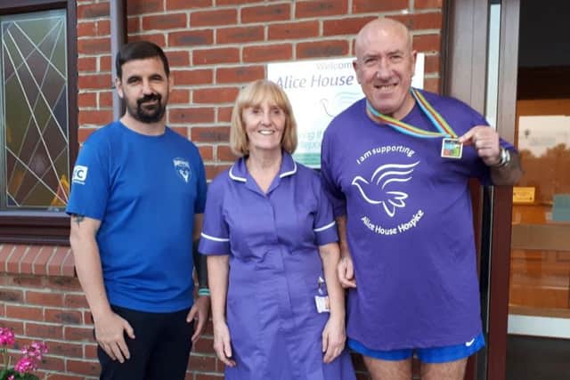From left, Darrel Slater, Linda Bellerby from Alice House and fundraiser David Cranson after his Big Lime Triathlon.