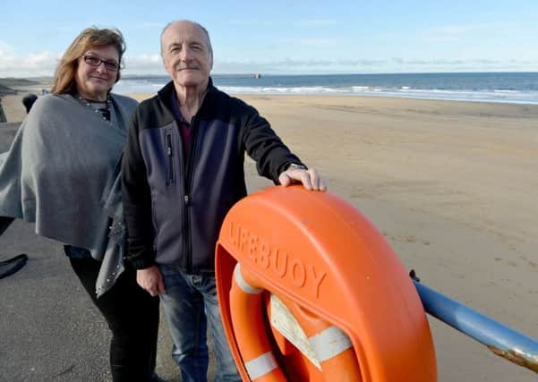 Joanne Griggs and dad Jack Hoyle by the lifebelt children removed from the promenade, Marine Drive, Hartlepool. Picture by Frank Reid