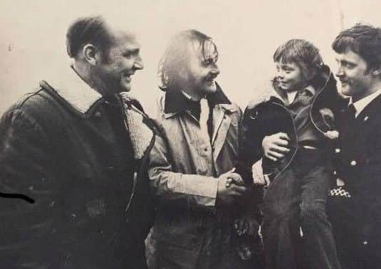 A picture of Jack Hoyle (second left) next to Anthony Gibbons as a child who Jack rescued in the late 1970s leading to a campaign to replace and install lifebelts.
