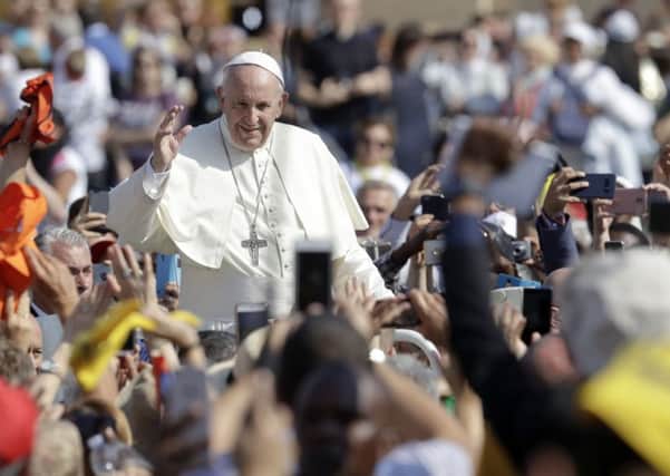 Pope Francis at the end of the canonization ceremony in St. Peter's Square at the Vatican before tens of thousands of pilgrims. (AP Photo/Andrew Medichini)