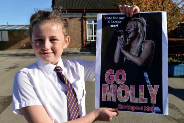 St Teresa's Primary school pupil Jessica Ward (10) with one of the Hartlepool Mail's "Go Molly" poster. Picture Frank Reid