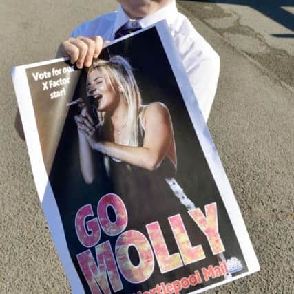 Coby McTaggart (10) shows his support for Molly Scott with the Hartlepool Mail's "Go Molly" poster Picture Frank Reid.