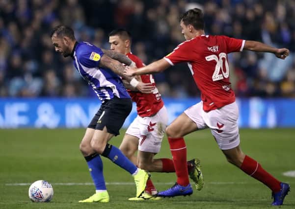 Sheffield Wednesday's Steven Fletcher (left) battles for the ball with Middlesbrough's Muhamed Besic (centre) and Dael Fry during the Sky Bet Championship match at Hillsborough.