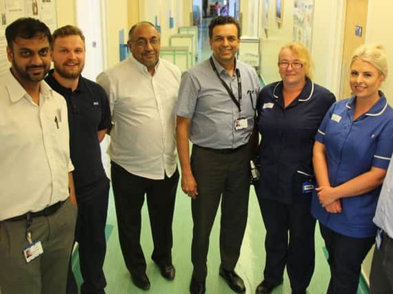 (from left): Foot and ankle registrar Mohammad Salim, physiotherapist Robbie Whittle, Dr Raju, Mr Limaye, ward matron Tracy Maddison, surgical care practitioner Beth Alderton and foot and ankle consultant Kadosa Bodo.