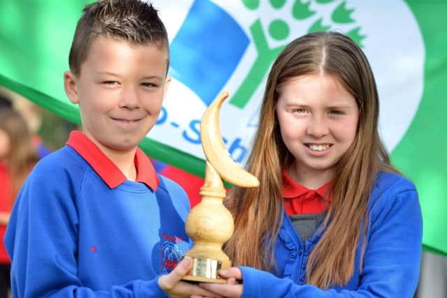 Throston Primary School eco council pupils Harry Nottingham and Annalise Frater with the Fairtrade Award
