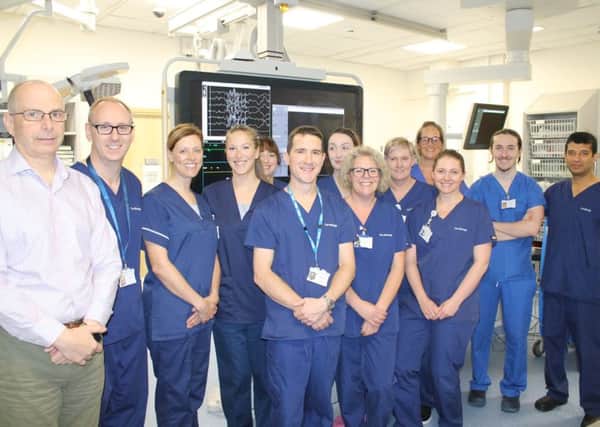 Staff from the heart unit celebrate the 10,000-pacemaker milestone.